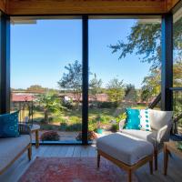 View of the inside of a screened back porch facing the backyard. 