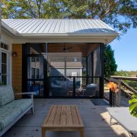 View of screened section of a screened back porch from the unscreened section of the back porch. 