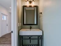 Hallway half bathroom with pocket door