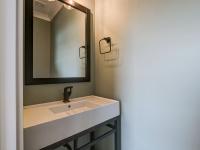 Hallway half bathroom with pocket door