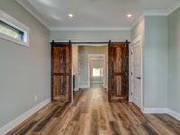 Interior room with wooden floors and rustic farmhouse sliding doors