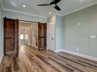 Interior room with wooden floors and rustic farmhouse sliding doors
