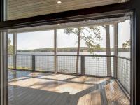 Lakeside view from rear screened porch on Rafter B Custom Home