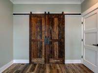 Interior room with wooden floors and rustic farmhouse sliding doors