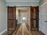 Interior room with wooden floors and rustic farmhouse sliding doors