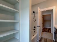 Bathroom with built-in shelving