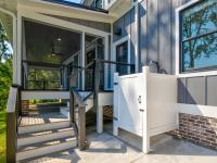 Screened porch of Rafter B custom lakeside home