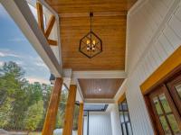 Wooden front porch ceiling with hanging light