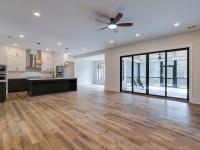 Room with white walls and wooden floors - Rafter B Construction custom home