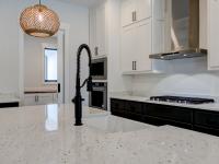 Close up of sink and marble countertops