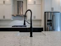 Close up of sink and marble countertops