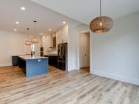 Alternate view of dining room and kitchen