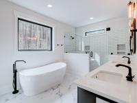 Ensuite bathroom with tub, double sinks and shower