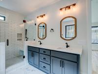 Ensuite bathroom with tub, double sinks and shower