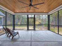 Screened back porch with wood ceiling and ceiling fan