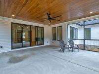 Screened back porch with wood ceiling and ceiling fan