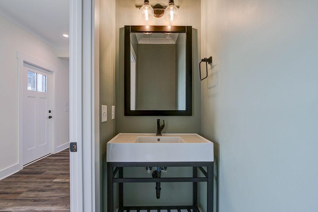 Hallway half bathroom with pocket door