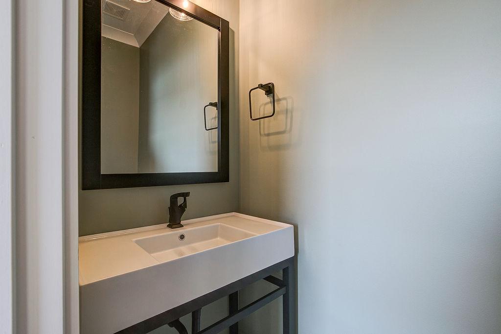 Hallway half bathroom with pocket door