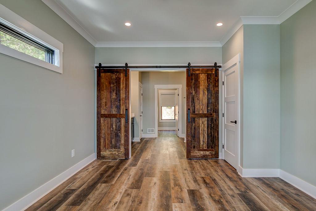 Interior room with wooden floors and rustic farmhouse sliding doors