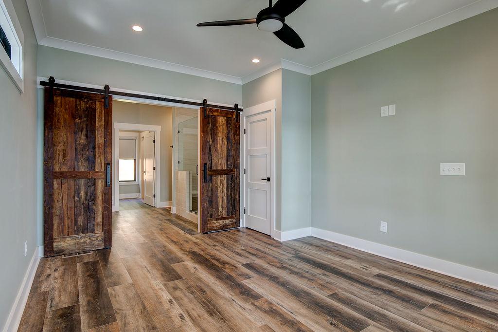Interior room with wooden floors and rustic farmhouse sliding doors