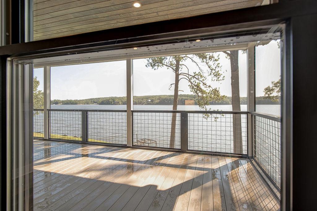 Lakeside view from rear screened porch on Rafter B Custom Home