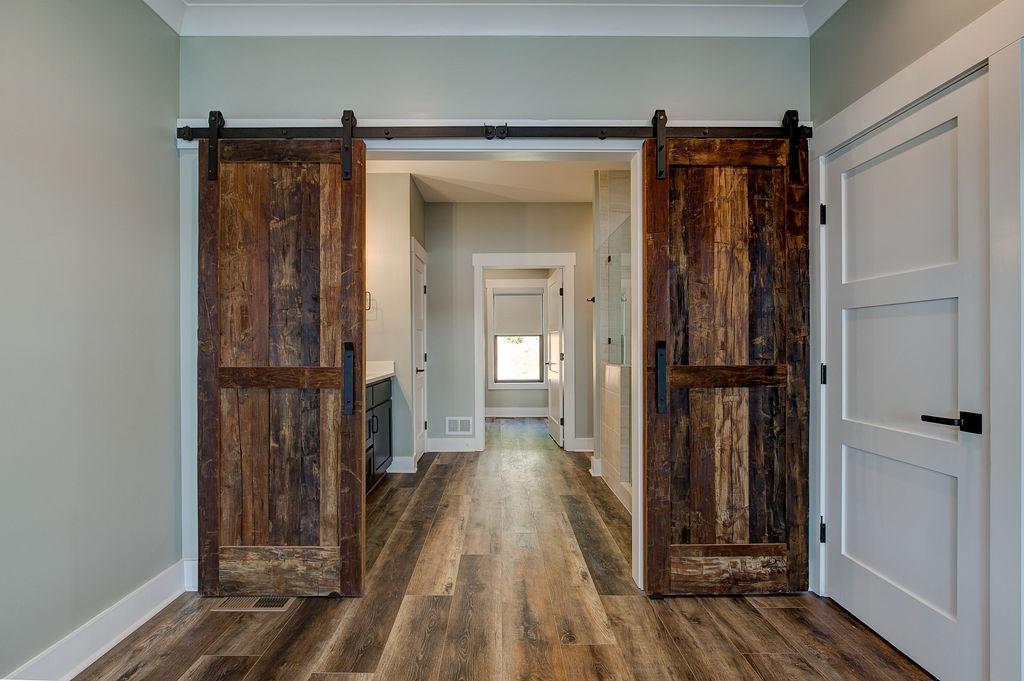 Interior room with wooden floors and rustic farmhouse sliding doors
