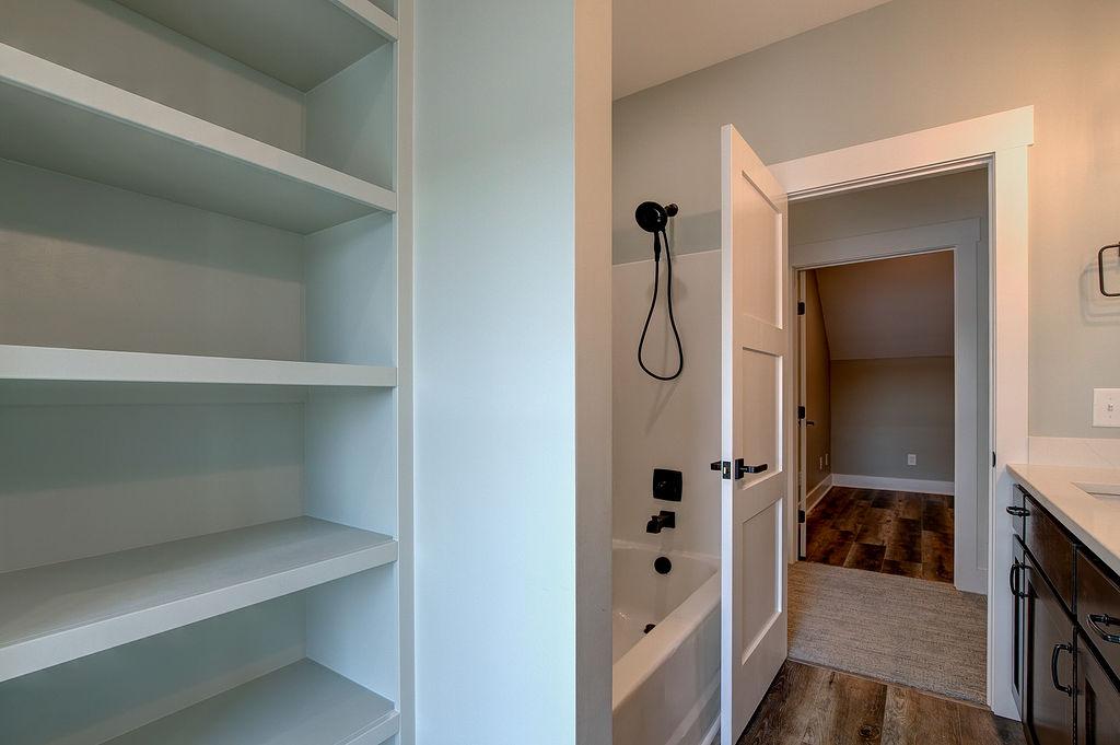 Bathroom with built-in shelving