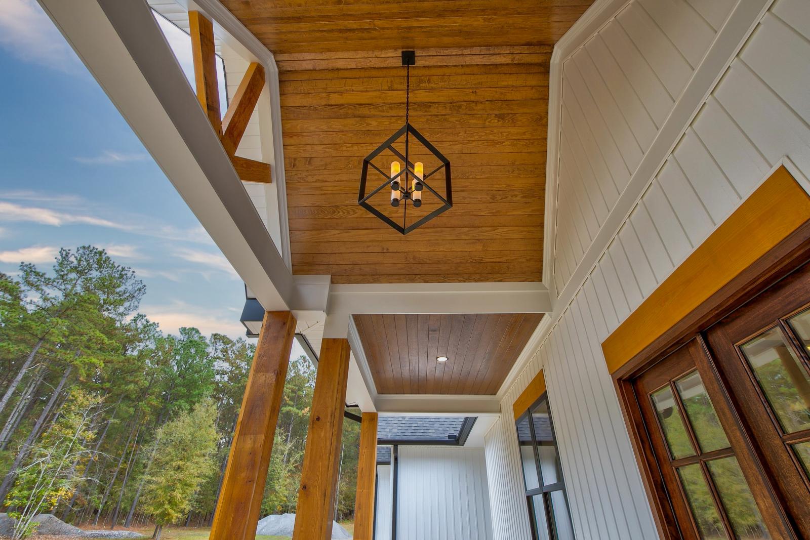 Wooden front porch ceiling with hanging light