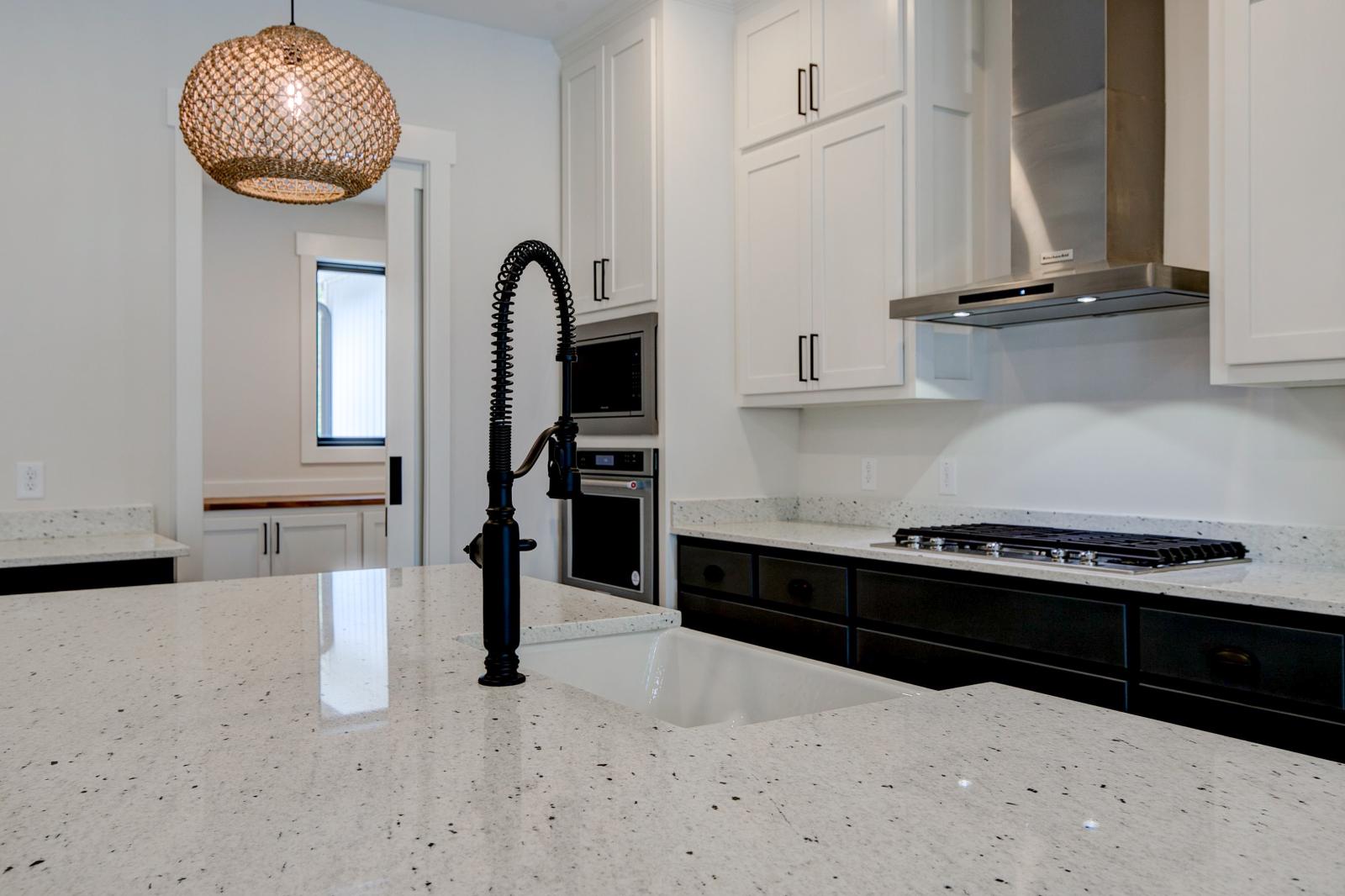 Close up of sink and marble countertops
