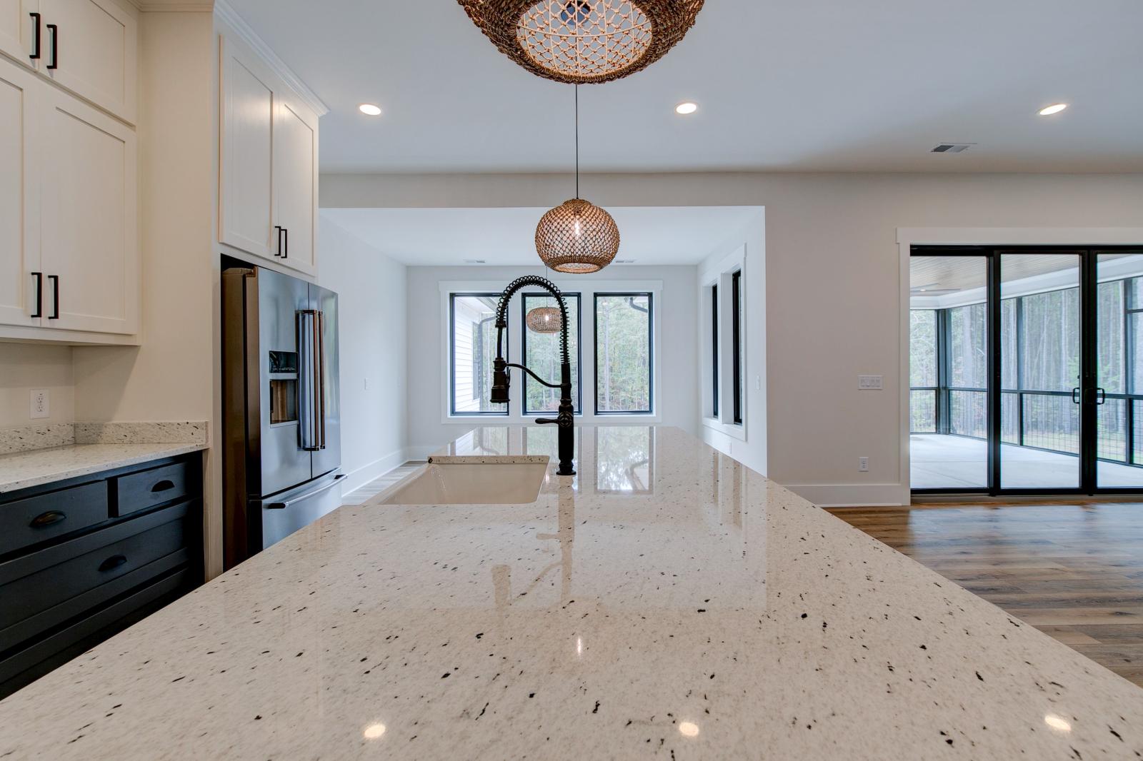 Close up of sink and marble countertops