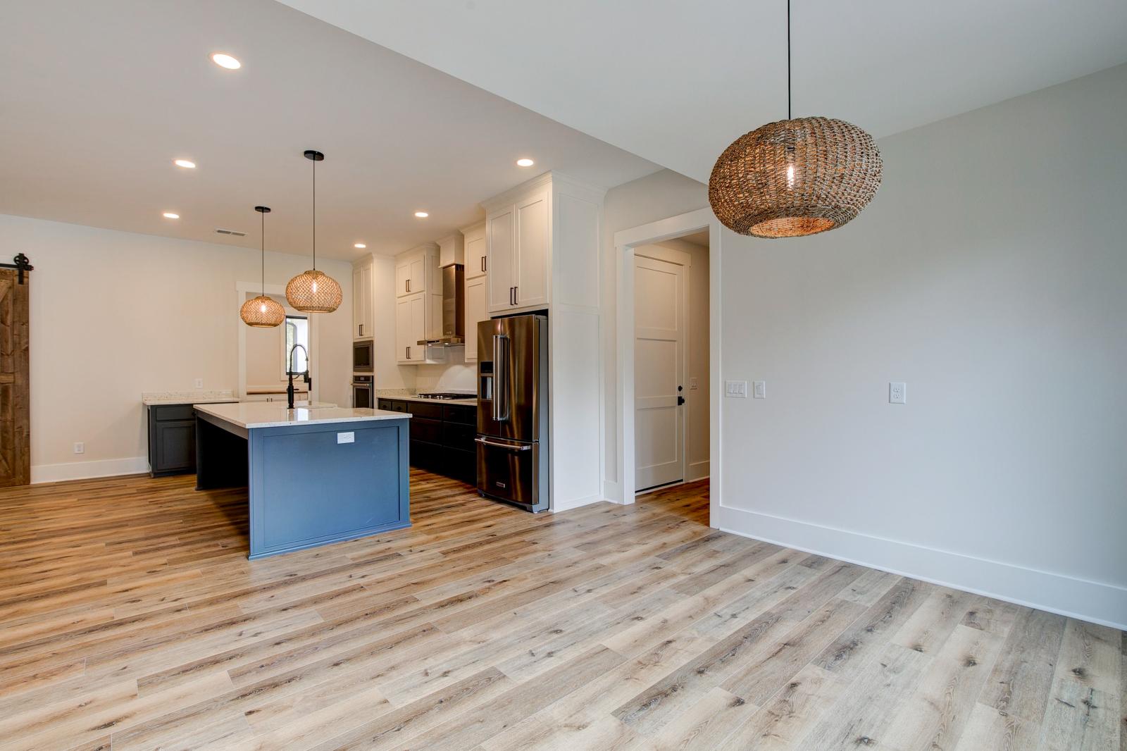 Alternate view of dining room and kitchen