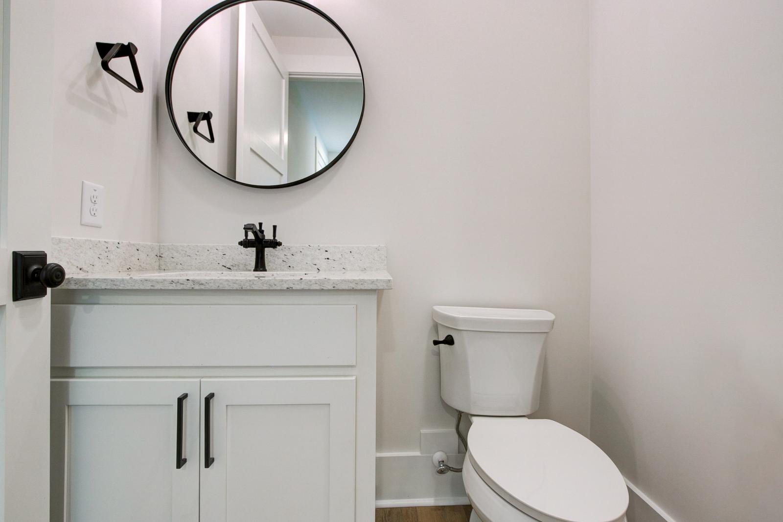 Bathroom with white cabinets