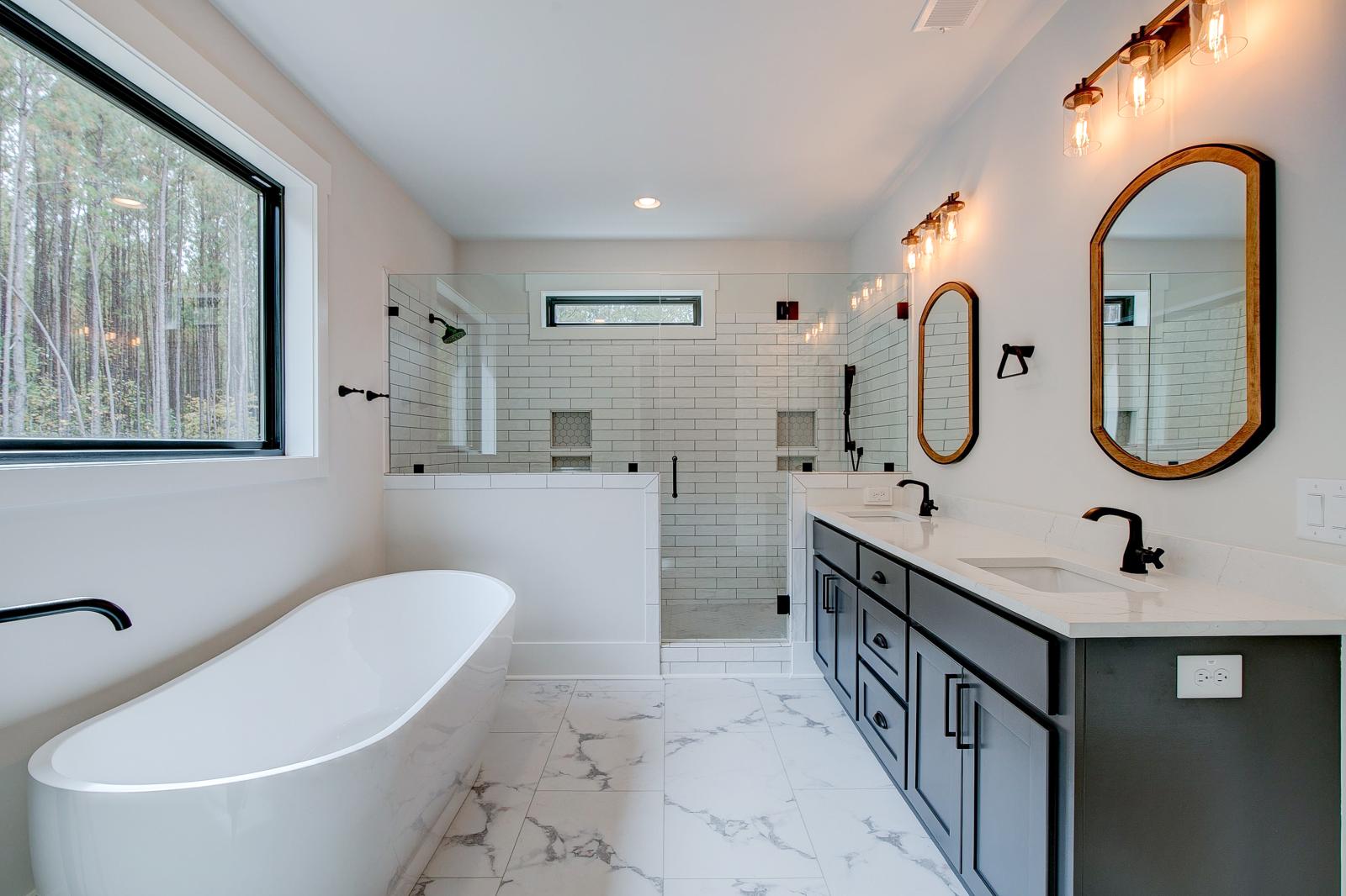 Ensuite bathroom with tub, double sinks and shower