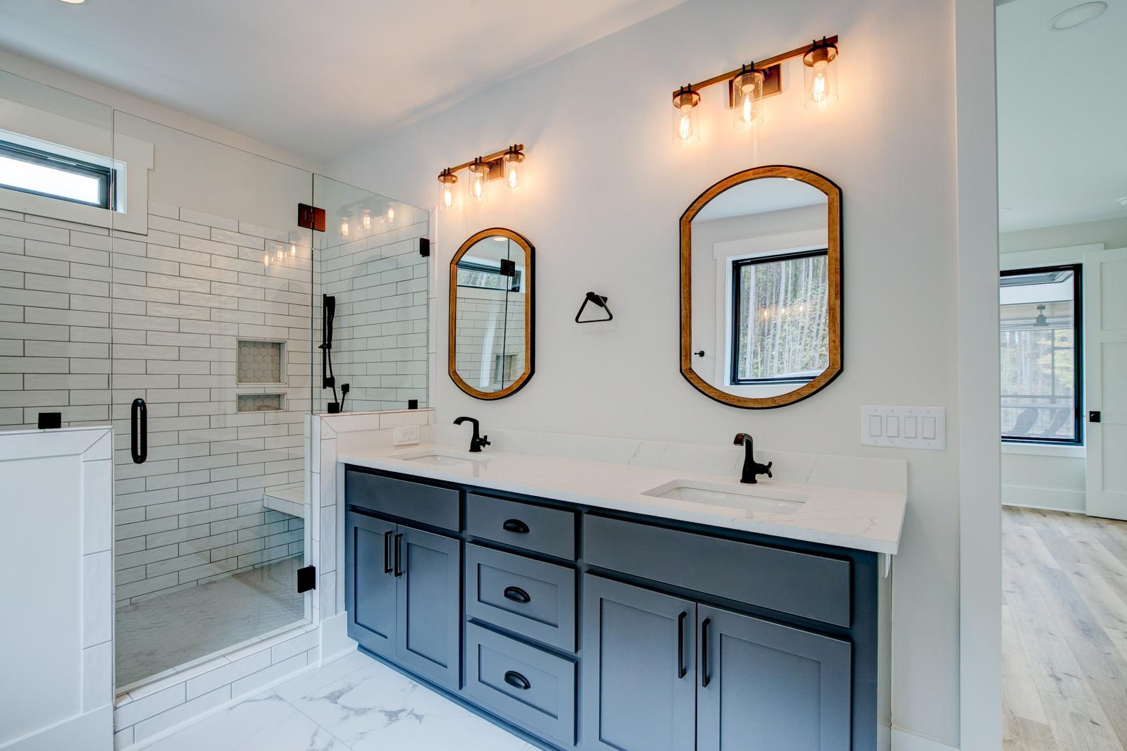 Ensuite bathroom with tub, double sinks and shower