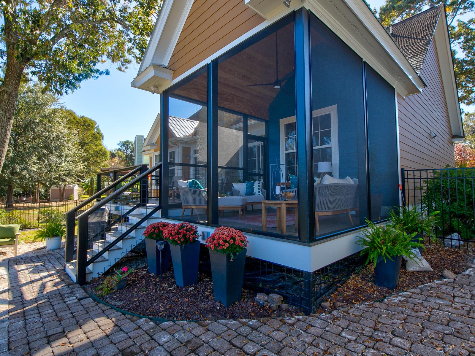 View of screened in back porch from the side.